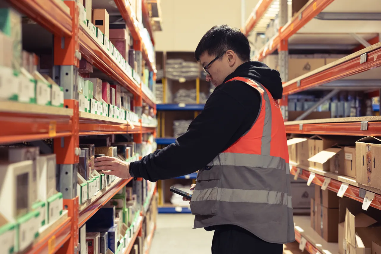 A FULFIL.X team member picking an order in one of our UK fulfilment centres